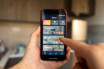 Home heating temperature control with smart home, close-up on the phone. Smart home concept and smart home control application
