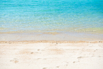 Sand beach with blue sea at coast.
