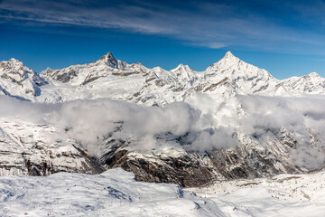 Fototapeta na wymiar Top of Gornergrate mountain range with snow and cloud, Zermatt, Switzerland.