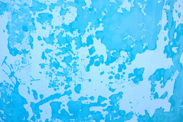 Photography of a painted surface with a paint stain. Texture and wallpaper.