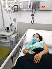 Woman Sitting In Hospital