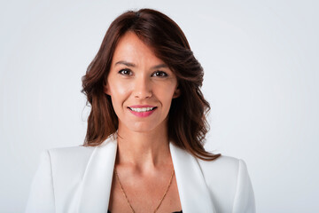 Studio portrait of attractive woman standing at isolated white background