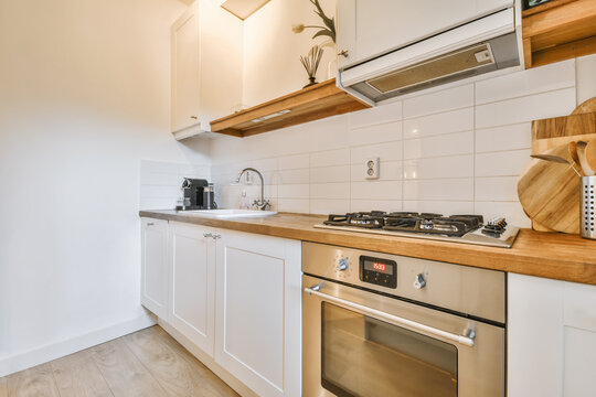 Fragment of interior of furnished kitchen with stove