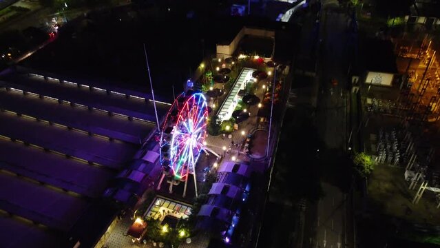 Aerial view of the terrace of a building with amusement park attractions