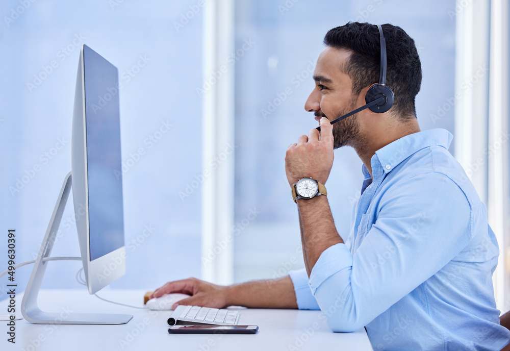 Canvas Prints Lets update your information. Shot of a young businessman working in a call center.