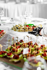 waiter holds plate with food. Restaurant service. buffet or catering