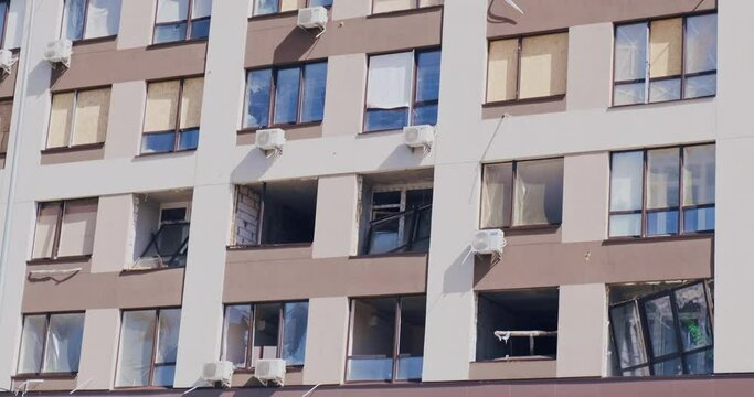 Destroying apartment windows after explosion of rocket, bomb. Ukraine war. Residential building windows were covered oilcloth. Broken windows in house from blast wave in Kyiv 2022. Terrorism attacks