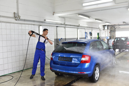 car wash as service/ after-sales service by mechanics in a garage/ car dealership