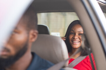 lady in the back of a car making a phone call