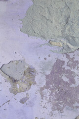 Fototapeta premium Old flaky wall with destroyed plaster. Renovation of old house. Industrial style design wall background. Grunge cracked concrete wall with old paint. Shabby peeling old background