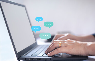 woman using laptop computer on desk Live chat online on communication websites, digital media applications and social networks.