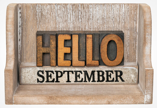Hello September in vintage letterpress wood type inside grunge wooden box, calendar concept