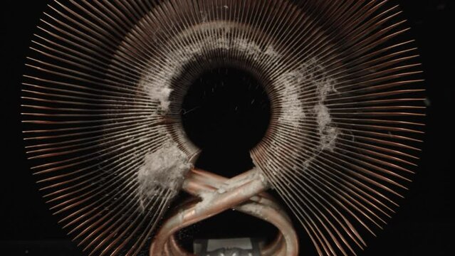 Copper computer heatsink. Cleaning from dust. Dolly slider extreme close-up inside. Laowa Probe