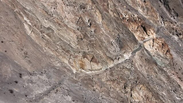 Aerial Flying Over View Of Section Of Old Silk Road On Mountain Side In Pakistan