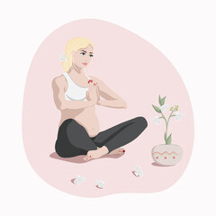 Obraz na płótnie Canvas Pregnant girl in lotus position doing yoga