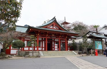 Fototapeta premium Hobutsu-kan Treasury Hall and Taho-to Pagoda in the precincts of Itsukushima-jinjya Shrine on Miya-jima Island in Amagaichi City in Hiroshima Prefecture in Japan 日本の広島県甘日市市の宮島厳島神社境内にある宝物官と多宝塔 