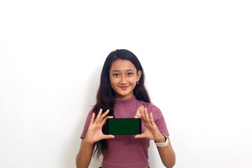 Naklejka premium Asian woman showing landscape blank screen mobile phone on hand isolated over white background