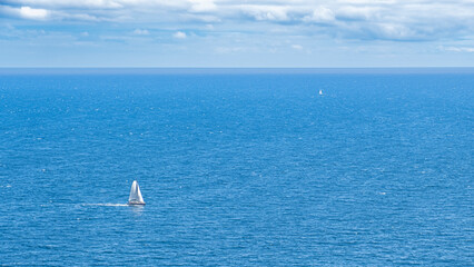Fototapeta premium The sea with sailboat from far and near