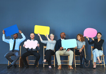 It feels good being able to speak your mind. Shot of a group of people holding up speech bubbles...