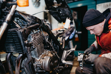 motorcycle repair in the garage, service maintenance of motorcycles, repair of the fuel system.