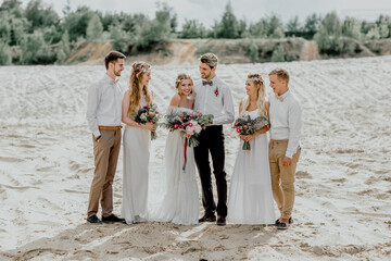 The bride and groom with friends. Beautiful wedding ceremony.