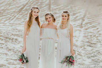 Girlfriend on the background of sand. The bride and bridesmaids.