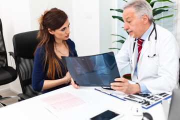 Fototapeta premium Doctor talking to his patient