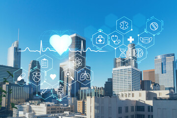 Panorama cityscape of Los Angeles downtown at day time, California, USA. Skyscrapers of LA city. Hologram healthcare digital medicine icons. The concept of treatment from disease, Threat of pandemic