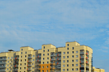 Fototapeta na wymiar Identical high-rise buildings. Same type apartment buildings against a blue sky