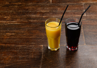 juice in glass on wooden background