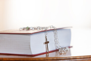 Holy Bible and Rosary with cross