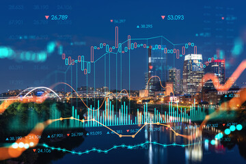 Panoramic view of Broadway district of Nashville over the river at illuminated night skyline, Tennessee, USA. Forex candlestick graph hologram. The concept of internet trading, brokerage and analysis
