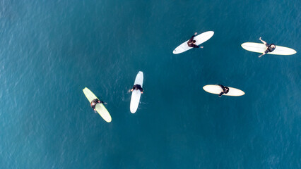 group surfers aerial view