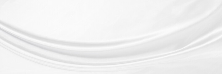 White gray satin texture that is white silver fabric silk panorama background with beautiful soft blur pattern natural.