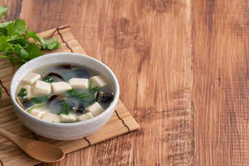 Delicious tofu and century egg soup with coriander.