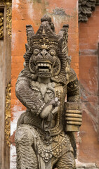 Fototapeta na wymiar Demon face stone carving at Tirta Empul Temple, Bali, Indonesia