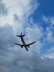 Airplane in the clouds. Plane in the sky