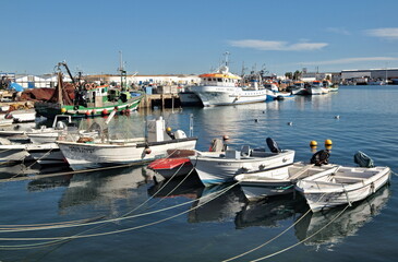 Fototapeta na wymiar Small boats on the ria in Olhao, Algarve - Portugal
