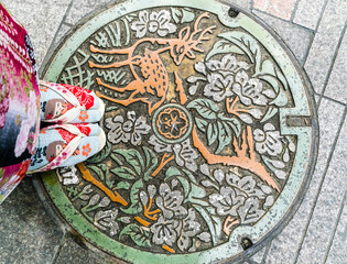 Manhole covers in Nara, Japan are carved with cherry blossoms and deer, the tourist hotspots of Nara City
