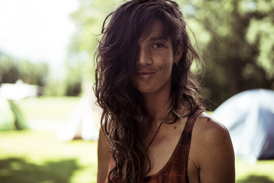 Natural Brown Woman Smiles In Summer Camp Site In France