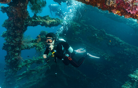diver exploring the wreck of the USS Liberty of the coast of Bali