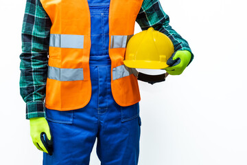 Construction or road worker wearing a high-visibility vest with a helmet under his arm, white background