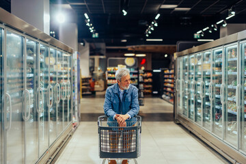 Senior adult man grocery shopping