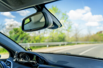 Summer travel concept and abstract background, view from the front window of the car to the road...