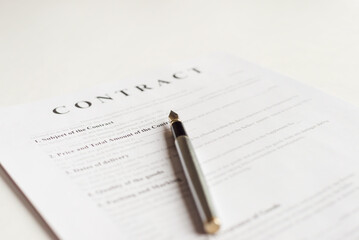 Contract documents on the desk in the office.