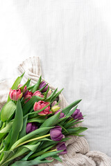 Bouquet of tulips on a white background, top view.