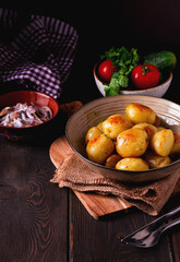 Fresh Cooked, new potatoes,with dill, on a wooden table, selective focus. close-up, toning, no people,