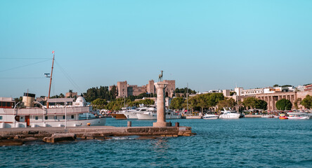 Rhodes old harbour Mandraki, Rhodes Island, Greece - 05 July 2021: bronze deer at port entrance,...