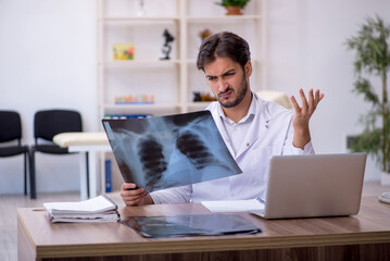 Young male doctor radiologist working in the clinic