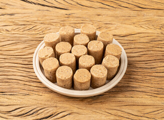 Pacoca, typical brazilian peanut candy and june festival food over wooden table